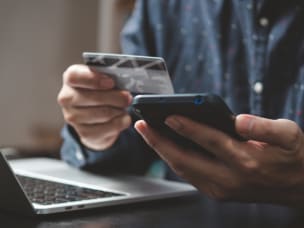 Person online shopping, shedding light on Awin's predictions on the key trends for Cyber Shopping Week