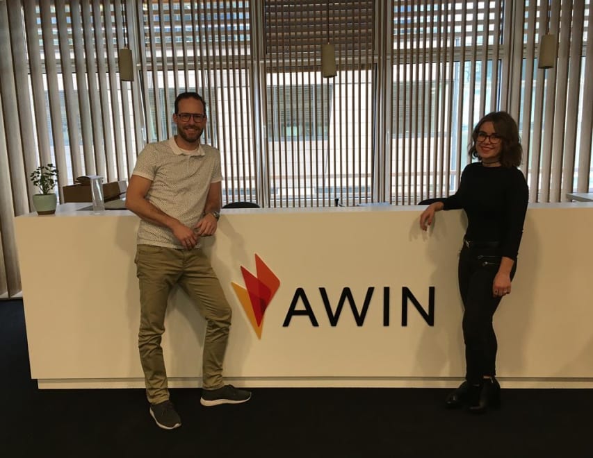 A photo of Fashiola CEO, Peter Langenkamp standing in front of the Awin HQ reception sign.