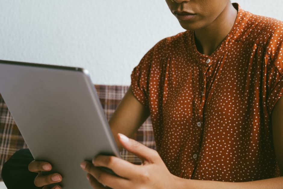 Women using tablet while shopping online at home