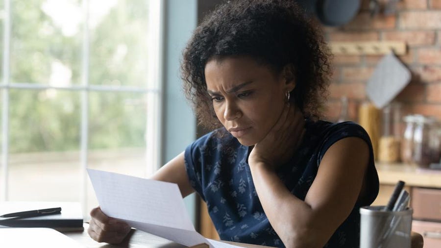 Business woman stuck with debt settlement