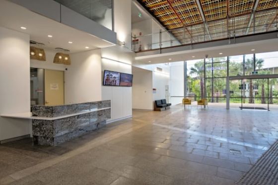 The foyer straddles a natural pedestrian route between the student village and the campus.