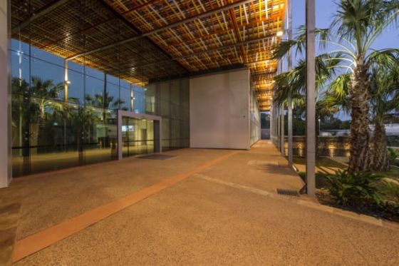 Exposed concrete floors, natural materials, textures and colours flow between inside and outside.