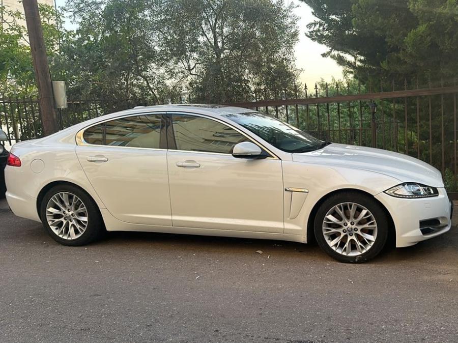 Side view of the white Jaguar XF