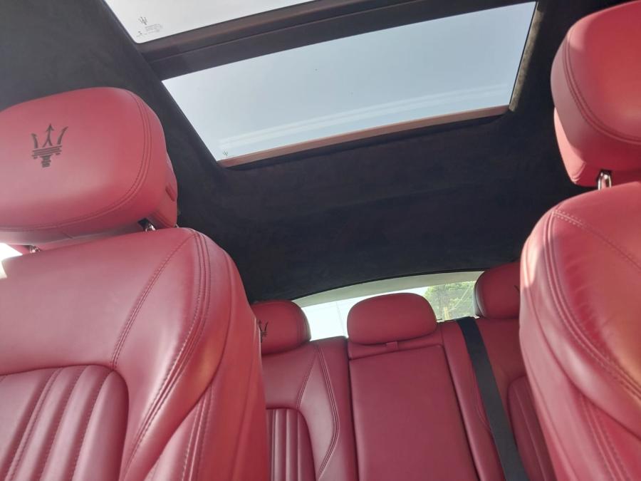 Red leather seats and sunroof inside the Maserati Levante