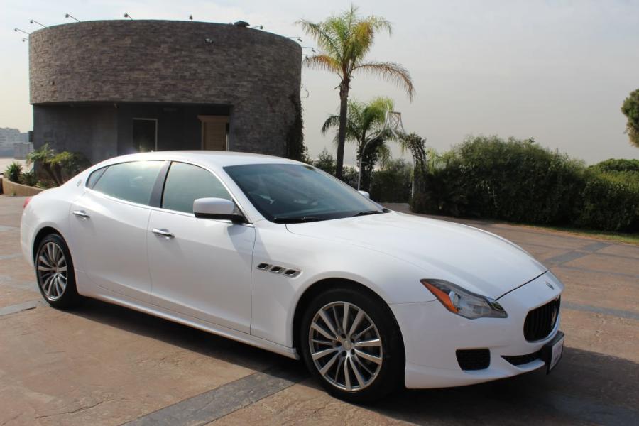 White Maserati Quattroporte at a venue in Bikfaya, front three-quarter view