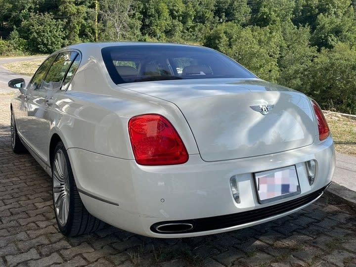Rear view of the white Bentley Continental Flying Spur