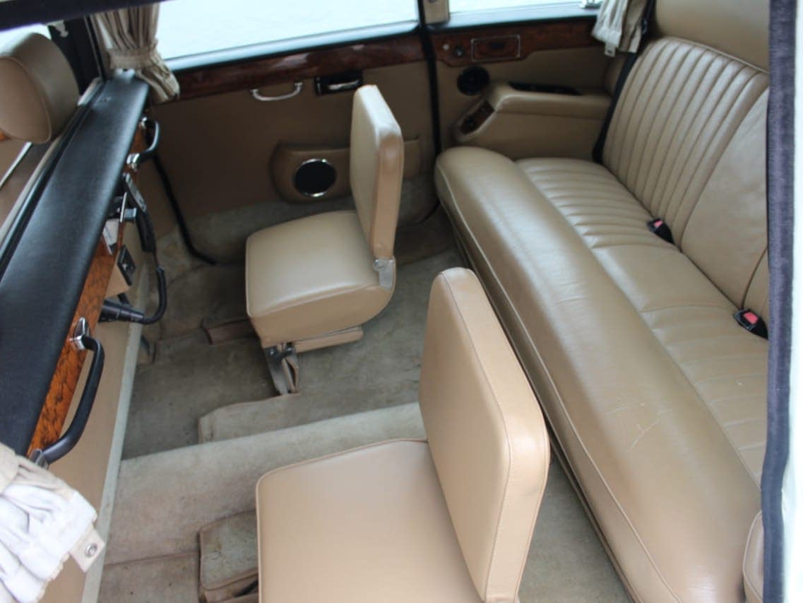 Cream leather rear bench and folding jump seats inside the Daimler DS420