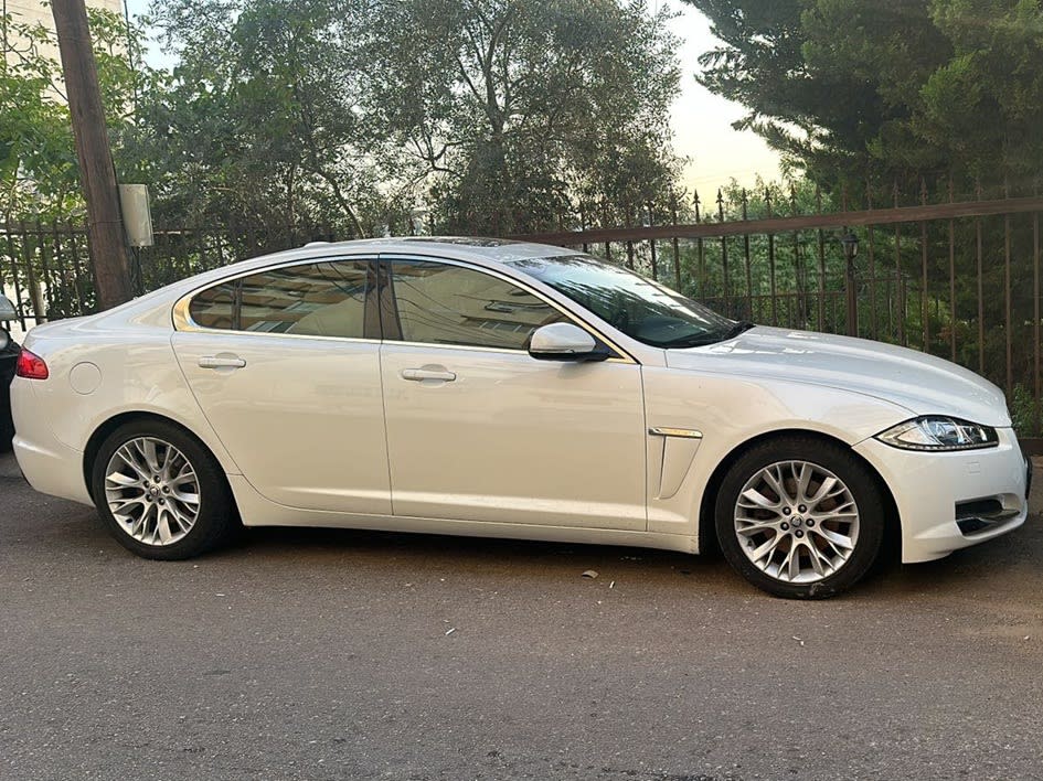 Side view of the white Jaguar XF