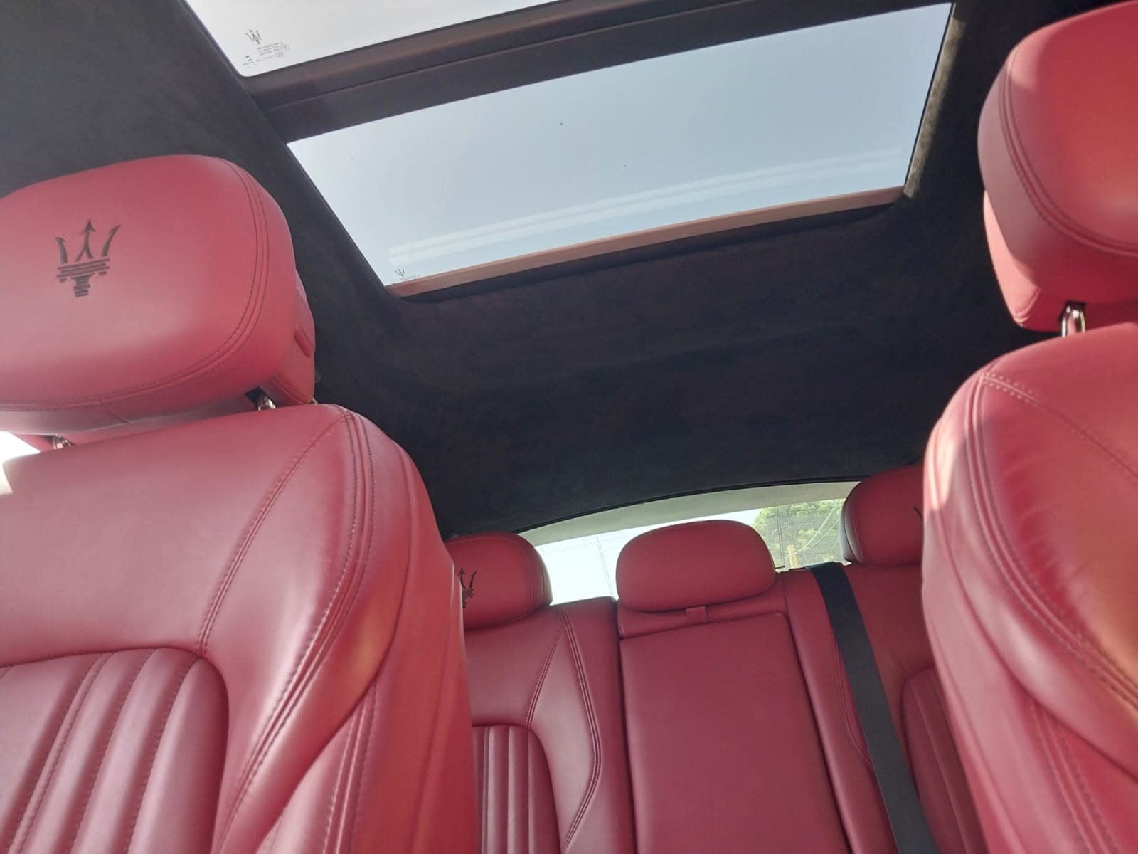 Red leather seats and sunroof inside the Maserati Levante