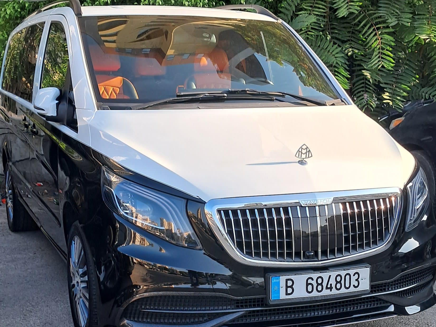 Close up of the front Mercedes Maybach Black and White wedding van