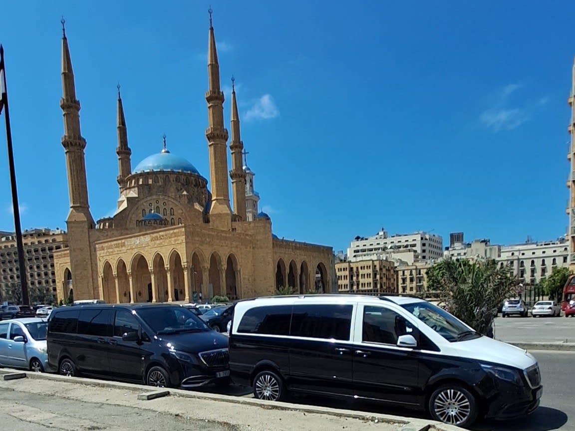 Convoy of luxury vans including both the Maybach and the V Class in down town Beirut with al Amin Mosque in background