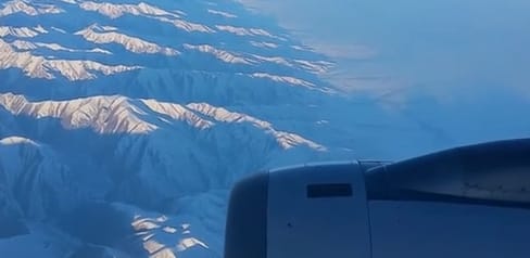 Air Astana KC907 over the Alatau Mountains