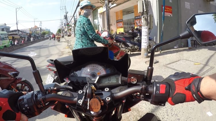 Ninja motorbike rider in Saigon