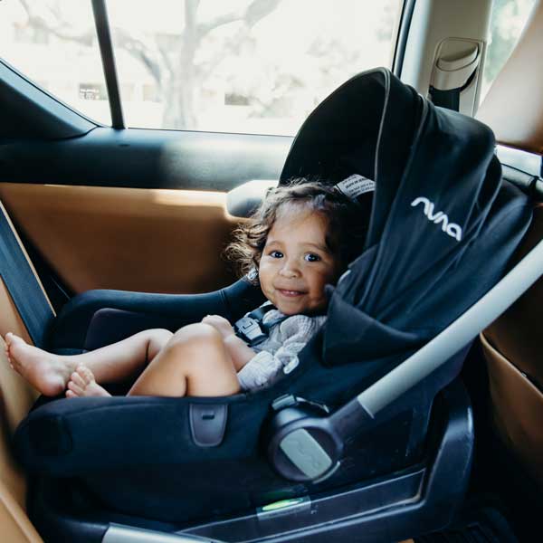 baby smiling in car seat
