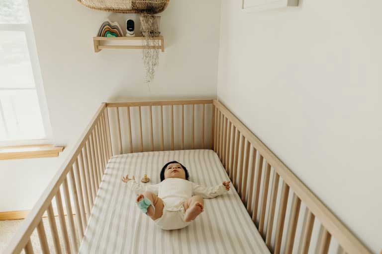 baby in crib with monitor