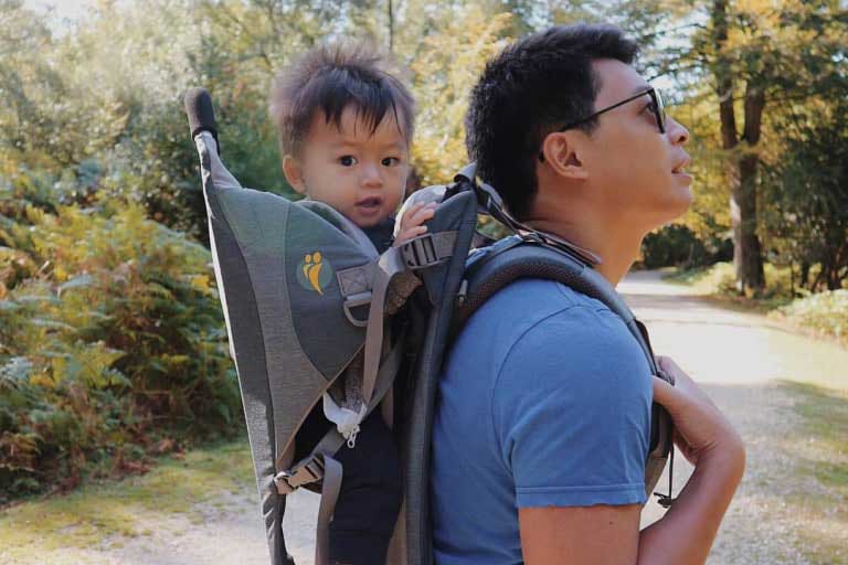 parent with hiking carrier