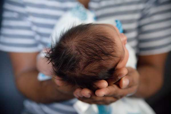 parent holding newborn