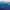Vue panoramique sur les Alpes qui se dessinent dans différentes nuances de bleu, avec un doux ciel rose en arrière-plan.