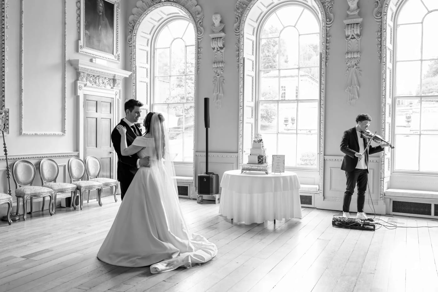 A couple dancing in a country house ballroom as Joel Grainger plays