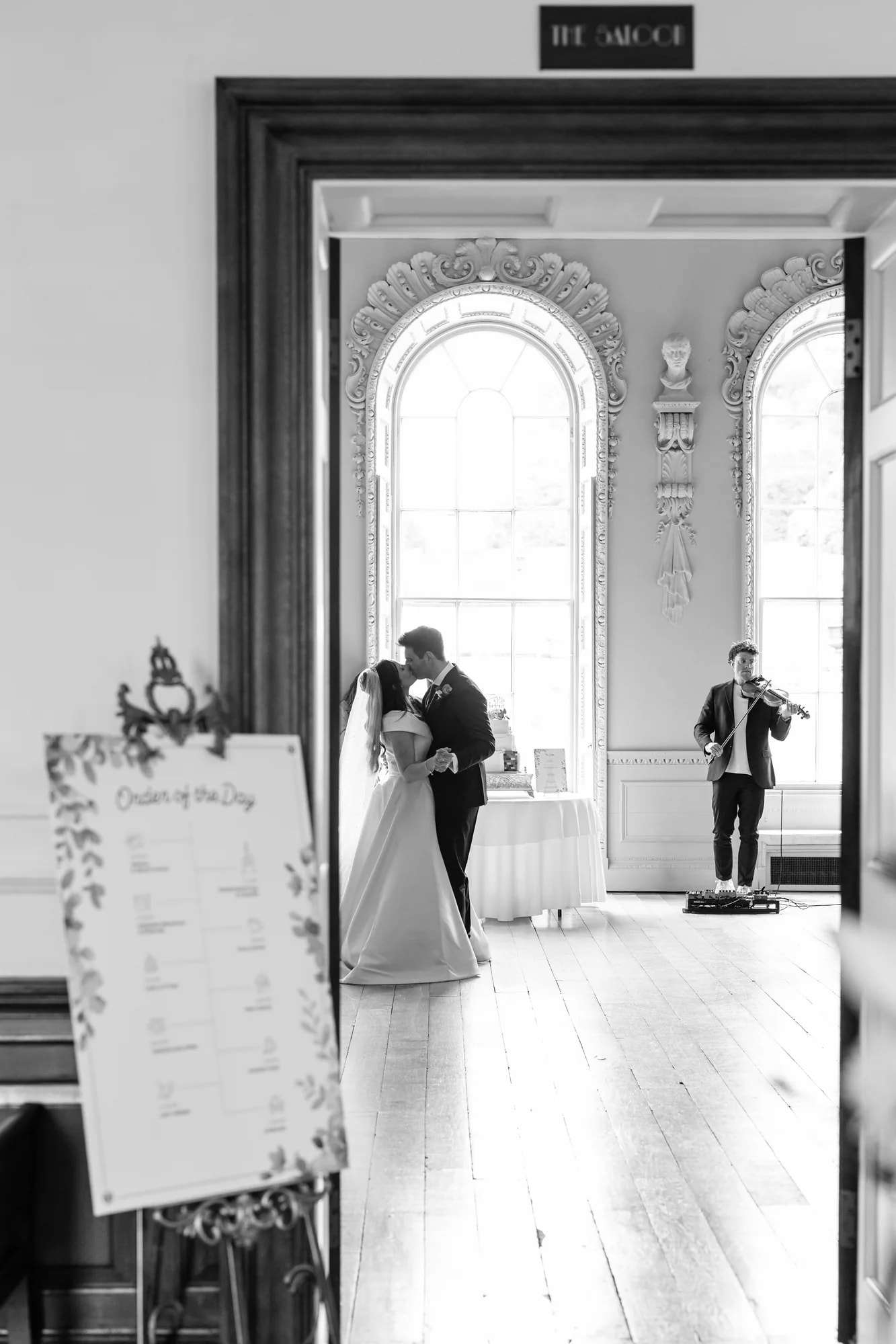 A couple sharing a first dance while Joel Grainger plays