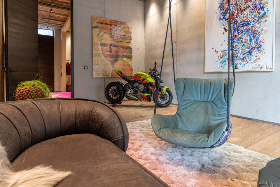 Gallery space with Baxter Leon swing seat in Kitzbühel chalet