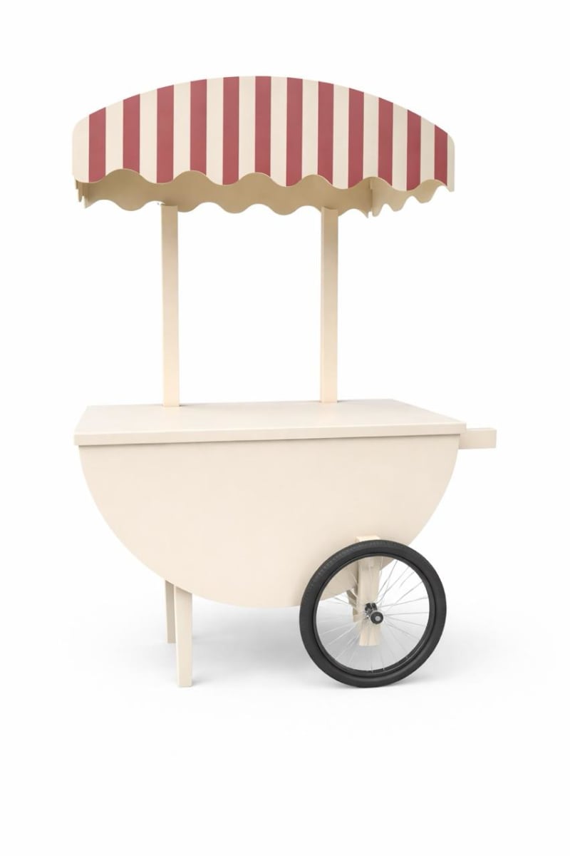 A wooden cart with a striped canopy stands on a plain background.