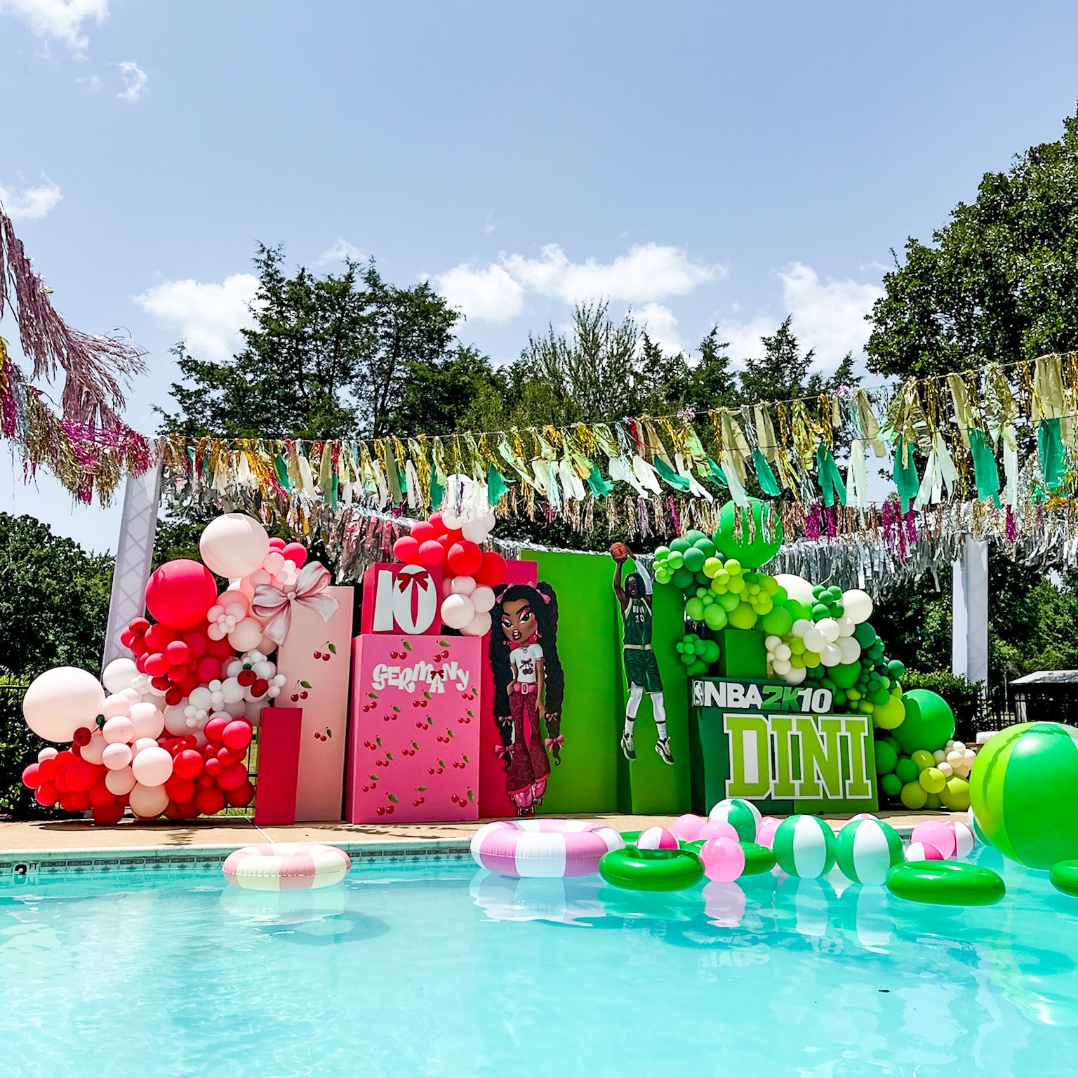 A vibrant and festive pool party scene with colorful balloons, streamers, and inflatable decorations surrounding a swimming pool.