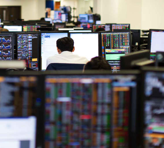 Photo of a man and woman sitting at their desks