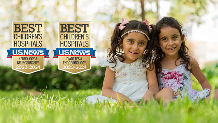 two young girls with BCH award logos