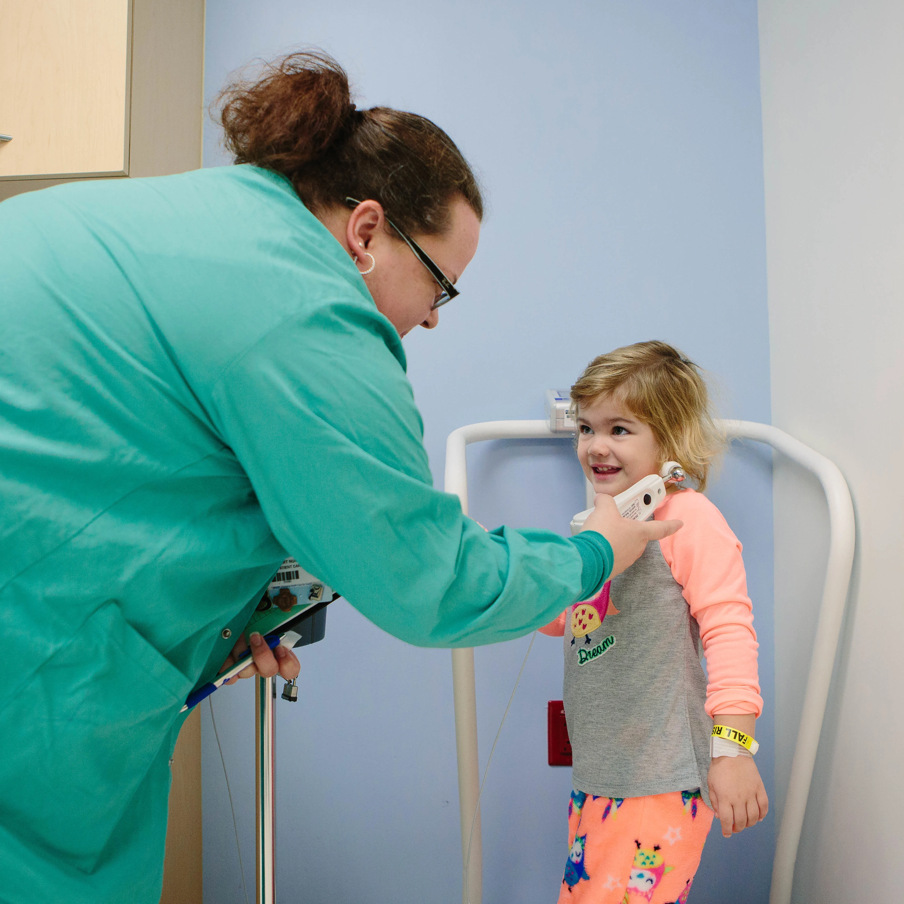 a provider performs an ENT test on a pediatric patient