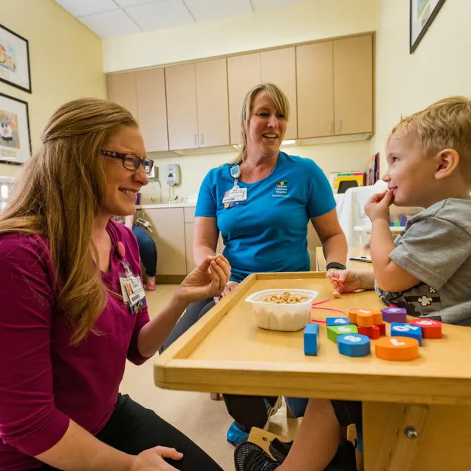 Speech-language pathologist working with a pediatric patient