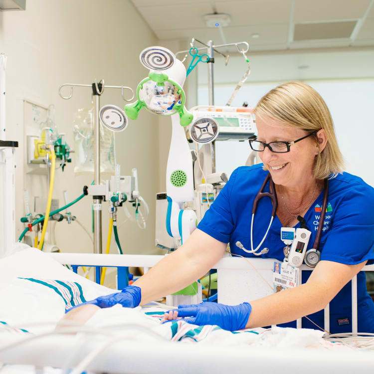 female registered nurse cares for baby
