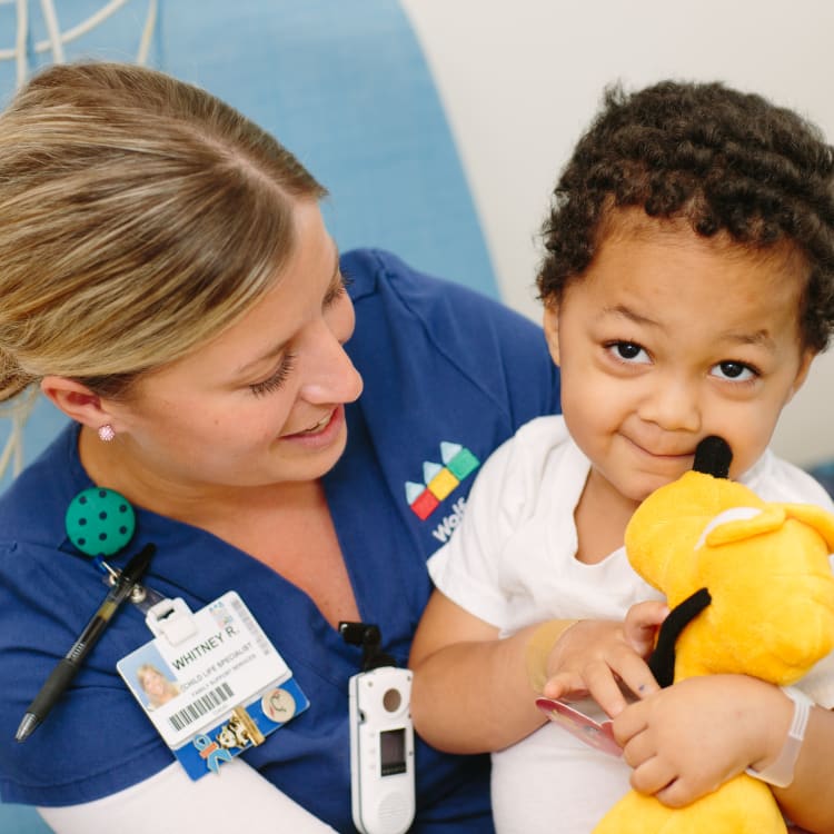 Nurse holding child