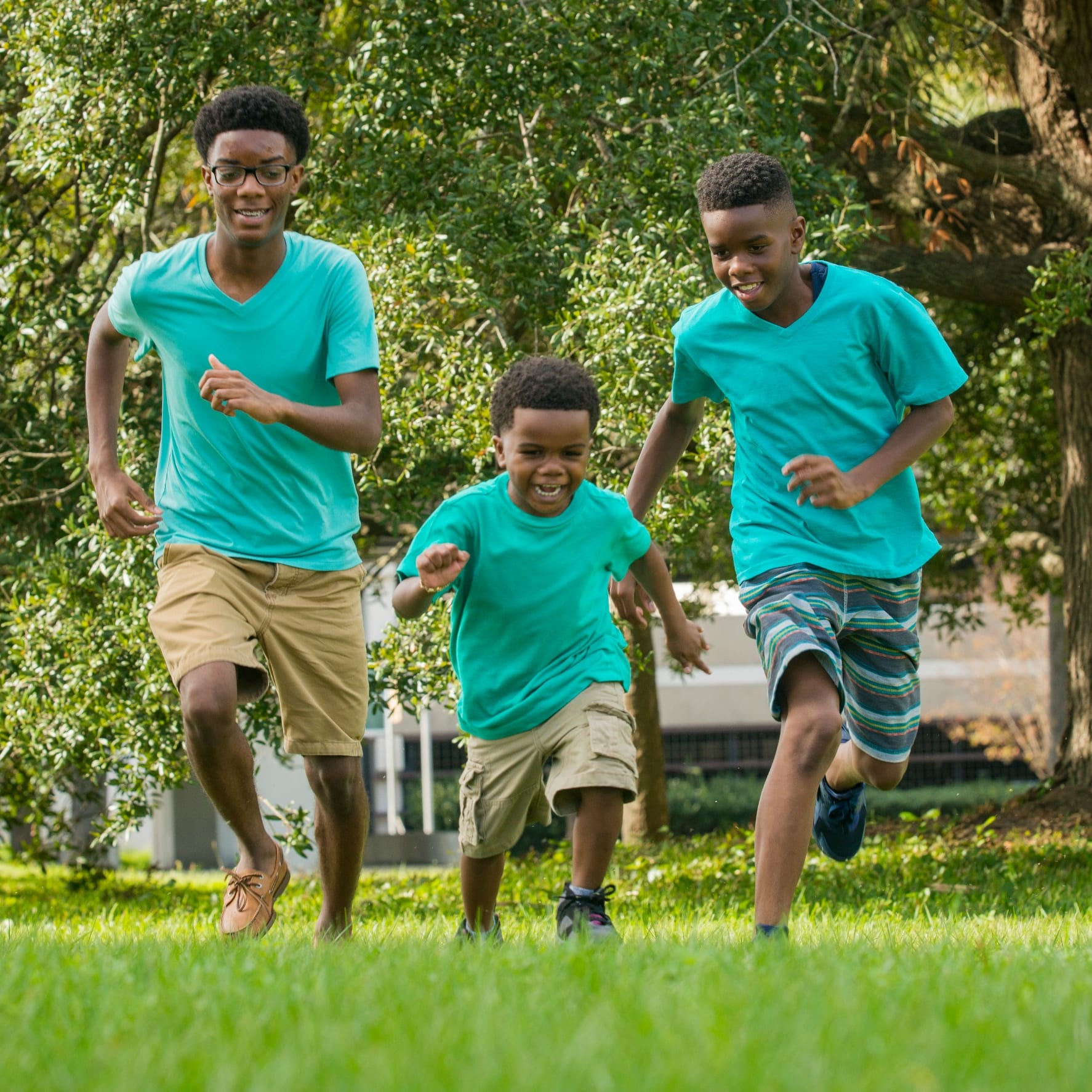 Three boys playing outside