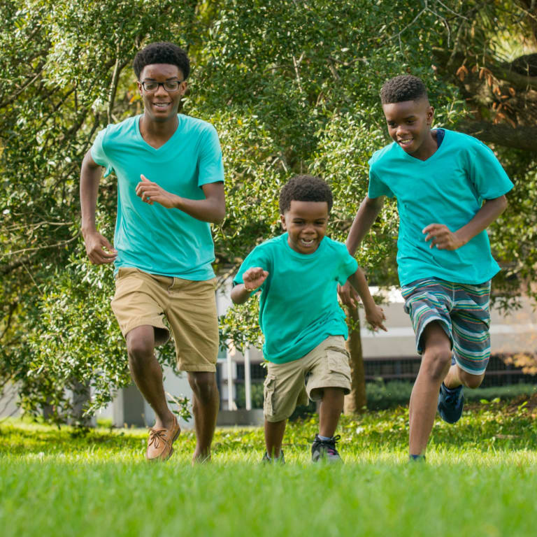 Three boys playing outside