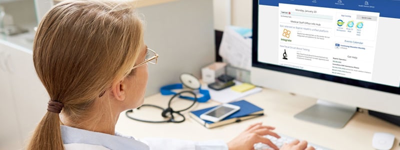 A female physician accesses the physicians portal on her computer.