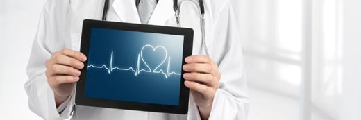 Doctor holding a tablet with an echocardiogram