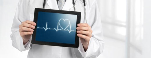 Doctor holding a tablet with an echocardiogram