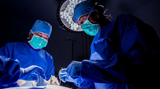 surgeons in the operating room during surgery