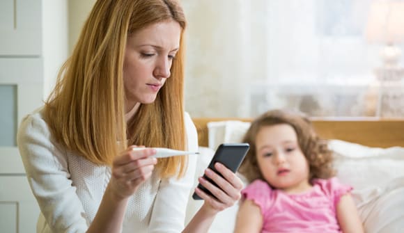 mom with child and thermometer