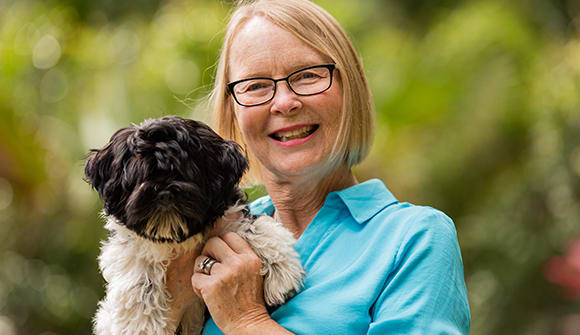 Debbie poses with dog