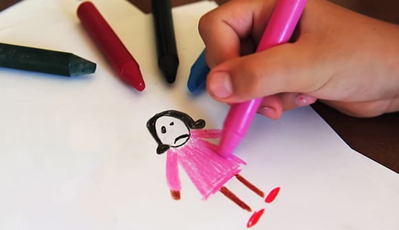 crayon drawing from a child of a sad girl