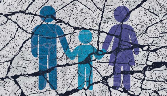 stick figure graphic of family drawn on broken concrete
