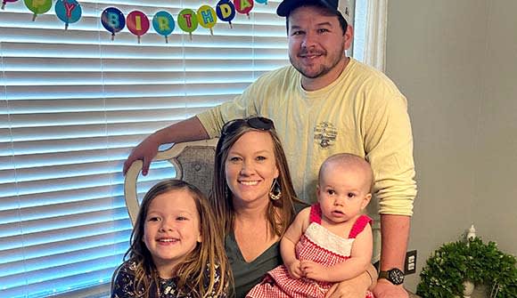 Josh and Ashleigh Atkinson with their daughters