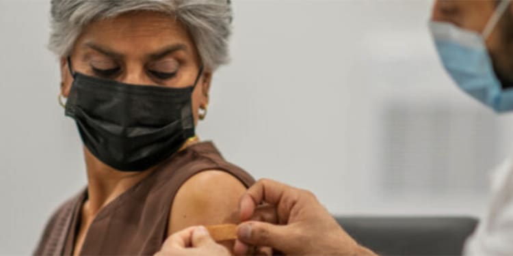 middle-aged woman getting her covid-19 vaccine