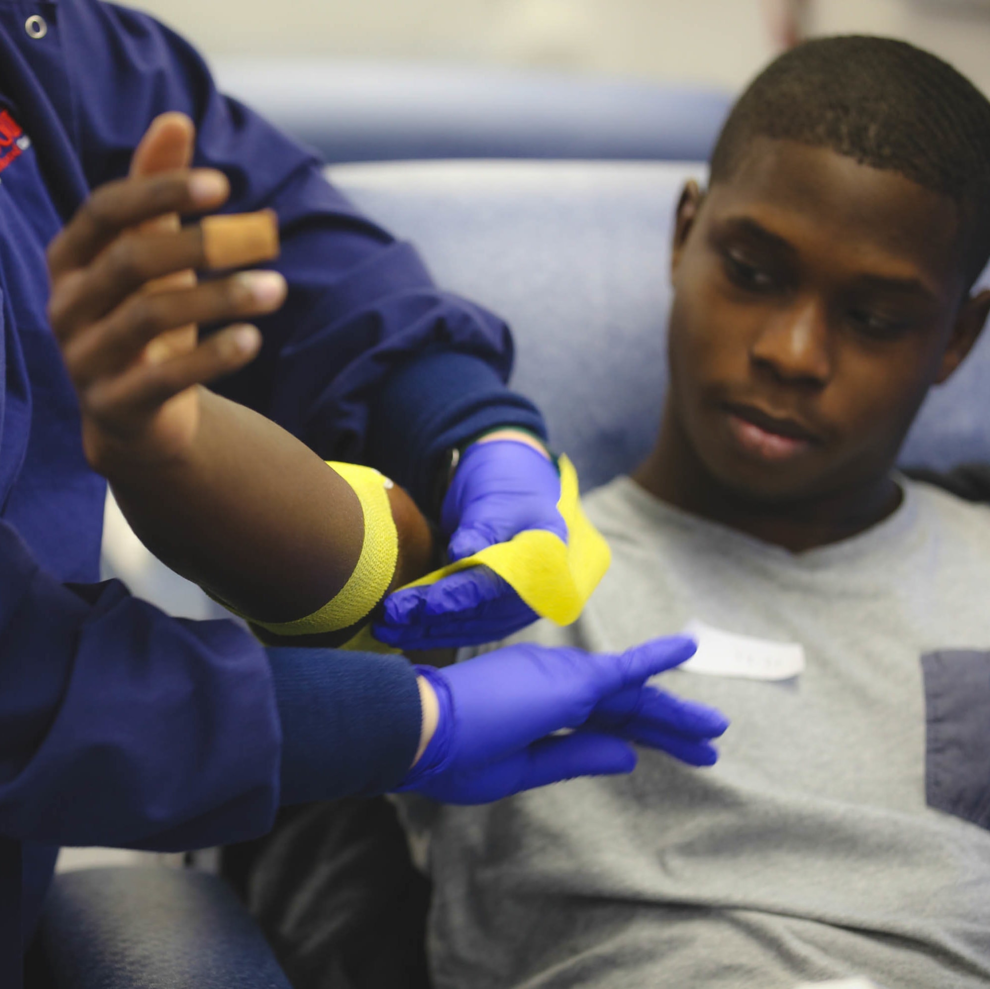 young man donating blood