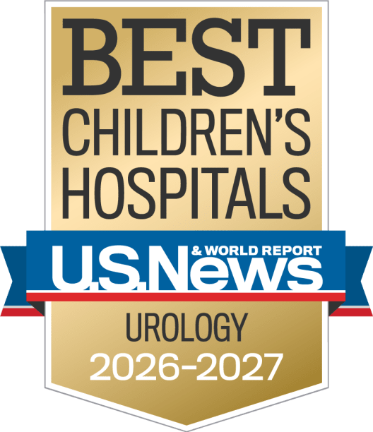 Gold, blue and red colored award badge reading "BEST CHILDREN'S HOSPITALS, U.S. News and World Report, Urology"