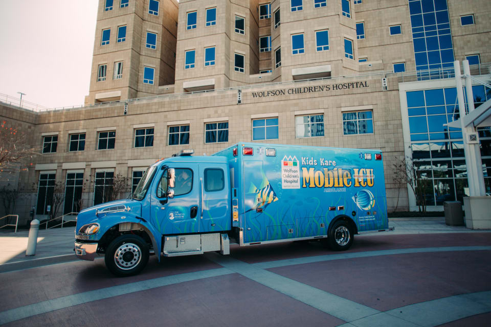 Kids Kare mobile ICU parked in the front of Wolfson Children's Hospital