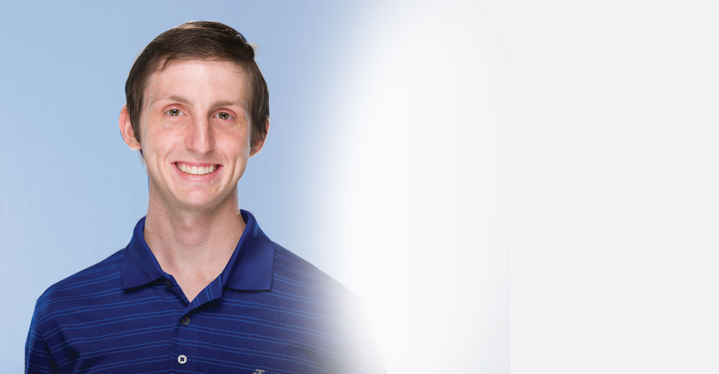 A headshot of Daniel Ellis.