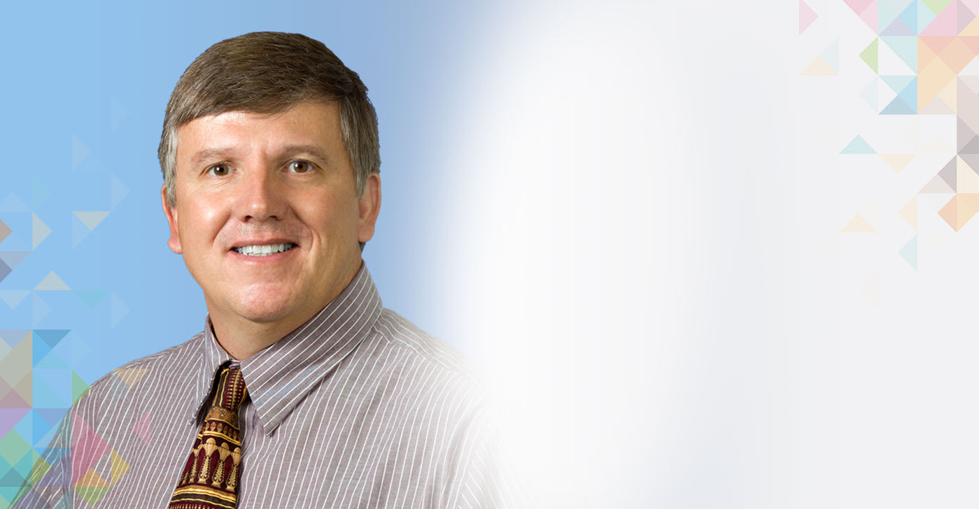 a headshot of Dr. George Royal.